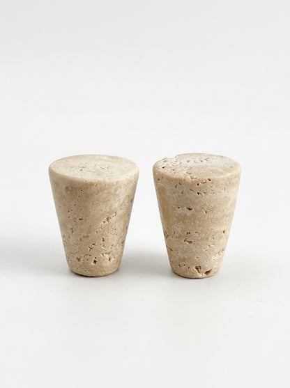 Yukixstone Classic Travertine stone cone knobs on a dark burgundy cabinet door