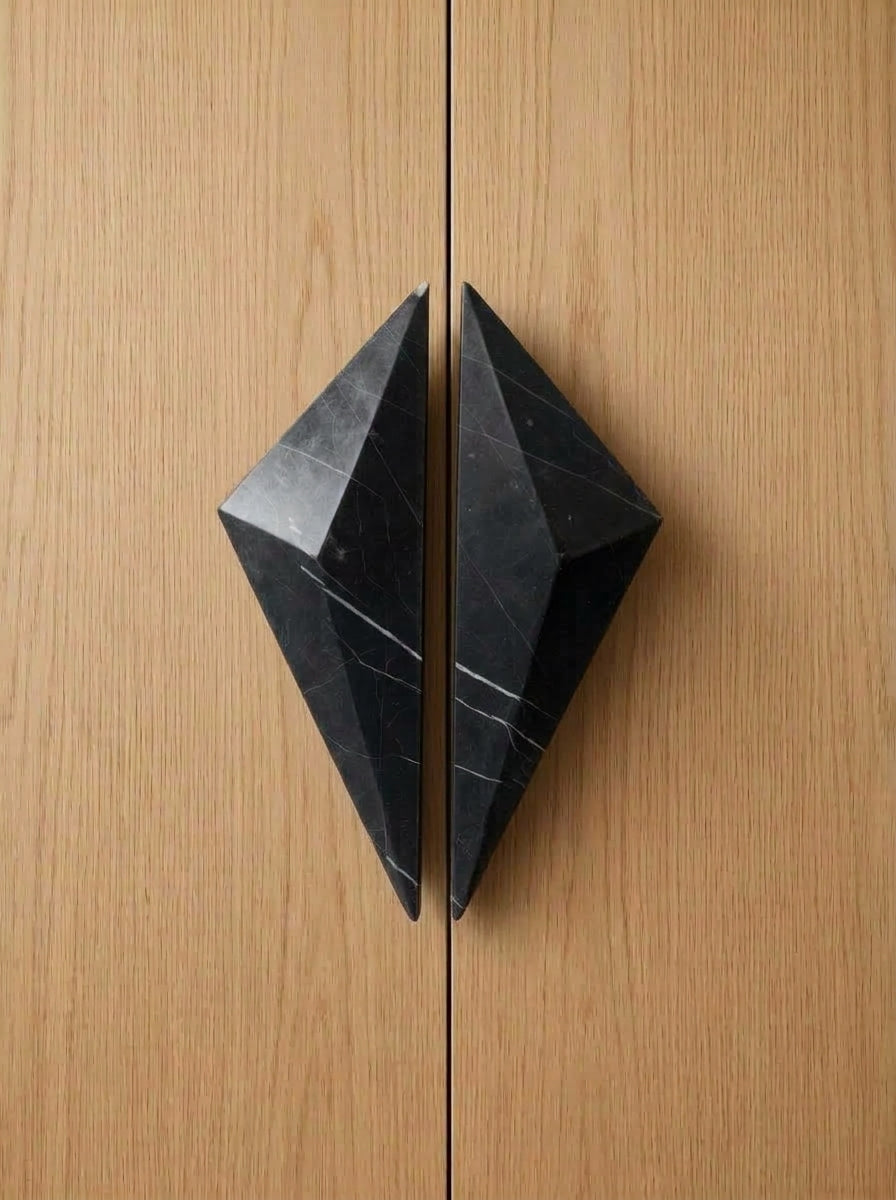 Yukixstone Diamond Stone Pull pair in Nero Marquina installed on closed oak double doors - the two faceted halves meet to form a full diamond