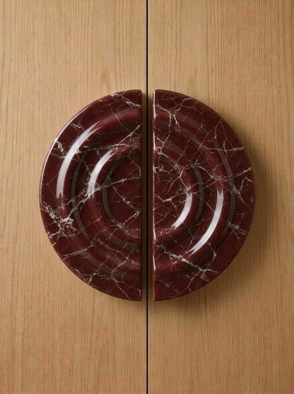 Yukixstone Rosso Levanto natural stone disc pull pair - hand-carved round marble door pull with concentric ripple carving, split across a pair of doors
