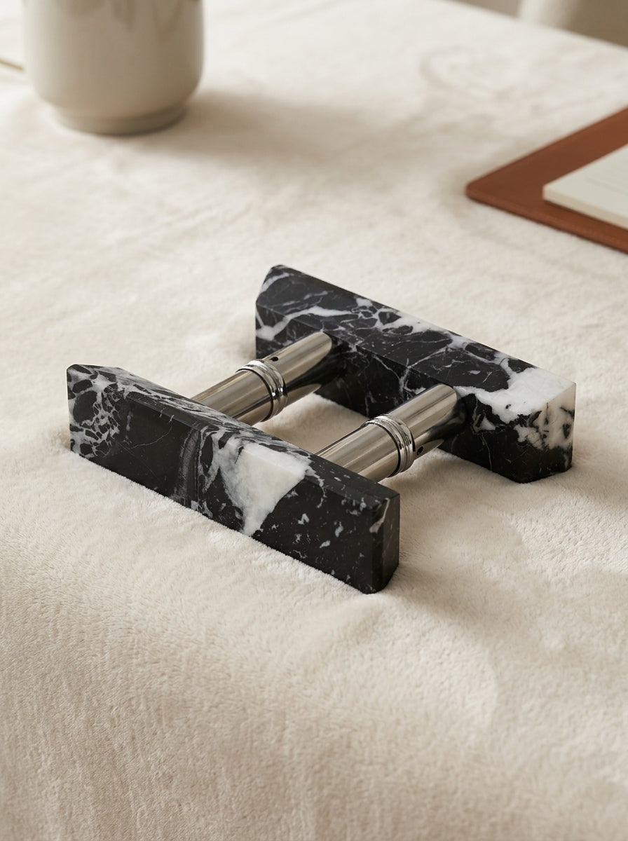 Yukixstone Ingot Stone Door Pull - double-side mount assembly of two chamfered Nero Marquina marble ingots joined by a brushed metal barrel, sold as a pair