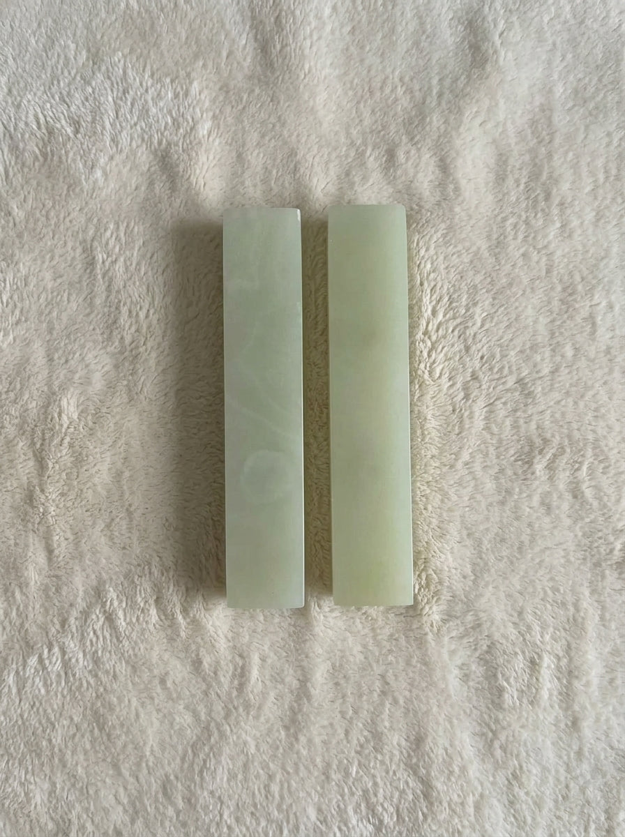 Yukixstone Onyx Bar Stone Pull - short size pair shown from the reverse with plain pale-green polished faces, laid on white plush fabric