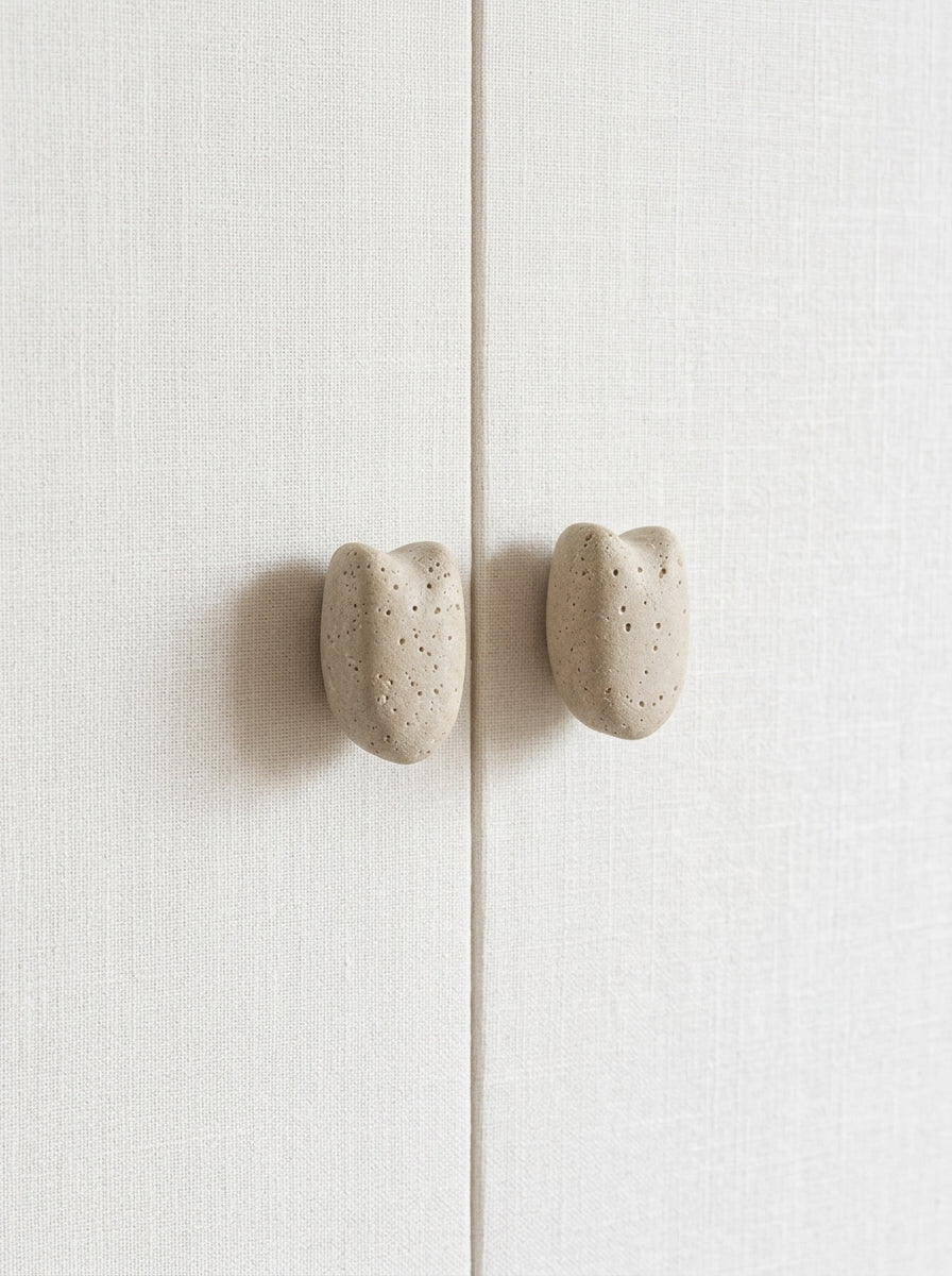 Yukixstone Classic Travertine stone pebble knobs installed on wardrobe doors - cream travertine cabinet knob pair