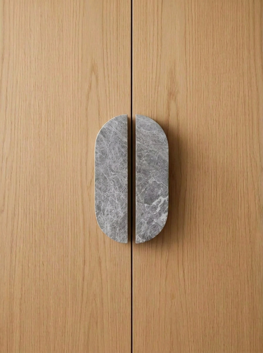 Yukixstone Pill Stone Door Pull - hand-carved oval split pull in Grigio Carnico grey marble, sold as a pair for wardrobes and double doors
