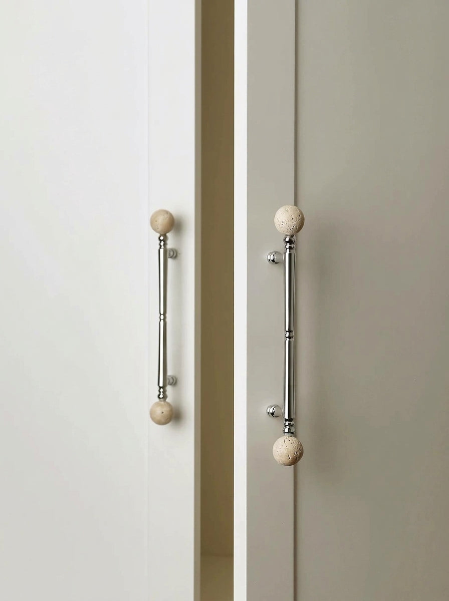 Long travertine ball stone pulls on cream wardrobe doors
