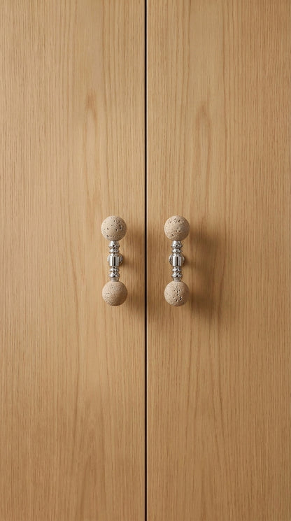 Short travertine ball T-bar pulls mounted on oak cabinet doors