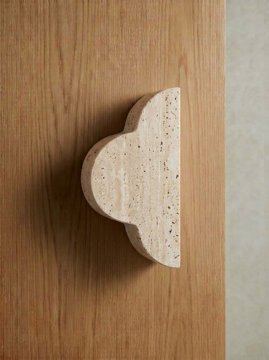 Yukixstone Quatrefoil Stone Door Pull - single half in natural travertine, sculptural curved side profile