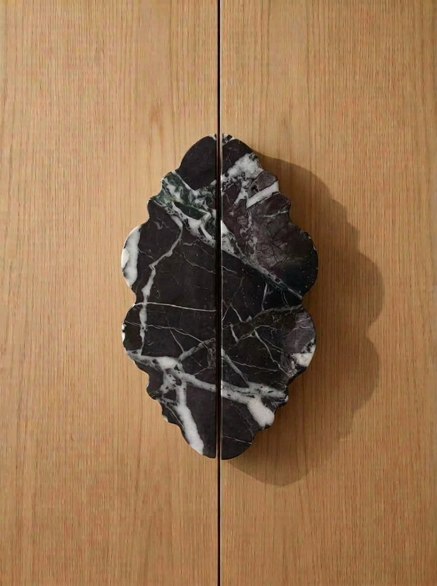 Yukixstone Ridge Stone Door Pull - lobed split pull hand-carved in Nero Marquina black marble with white veining, mounted on oak double doors