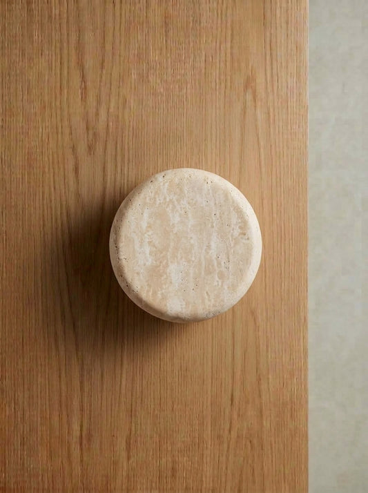 Yukixstone Round Stone Knob - smooth hand-sanded travertine drum knob on an oak wardrobe door, sold as a pair