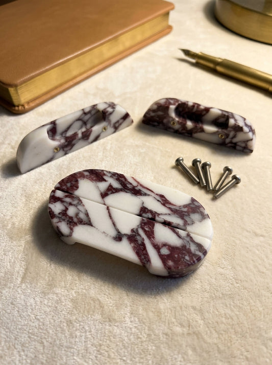 Yukixstone Viola Oval Stone Door Pull - pair of Calacatta Viola marble halves shown with concealed fixings and mounting screws beside the completed oval